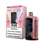 Load image into Gallery viewer, Box of RIA NV30K in flavor Peach Gummy (left side) with its device (right side) in color peach with black screen.
